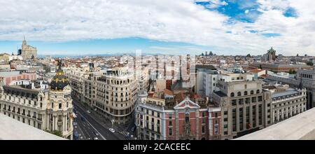 Panorama view of Gran Vía and Madrid's skyline on a cloudy Spring early morning, with the Metropolis building to be recognized in the foreground. Stock Photo