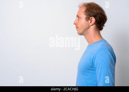 Man with blond hair against white background Stock Photo