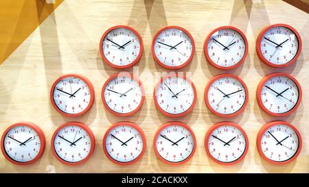 The clock on the wall is arranged in a row. Stock Photo