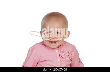 Adorable baby with a headscarf beating the disease Stock Photo