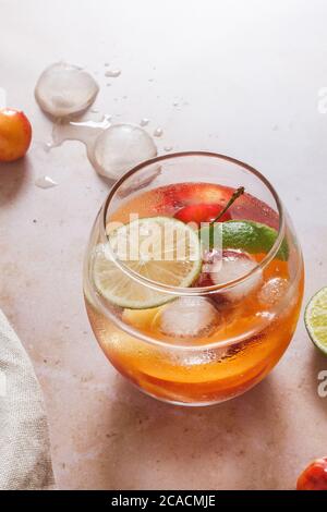 Summer cocktail of cherry and apricot gin and tonic