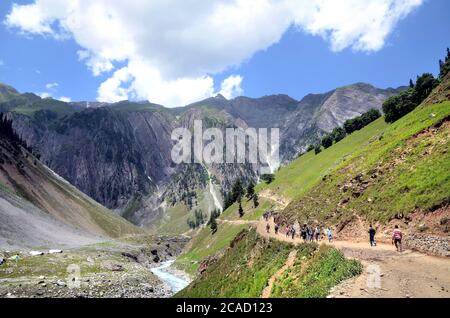 Hindu devotees visit during their pilgrimage from Baltal Base Camp to the holy place Amarnath Cave Shine located at an altitude of 12,729 feet. Stock Photo