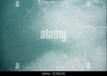 white air bubbles in turquoise water of Lake Brienz Stock Photo
