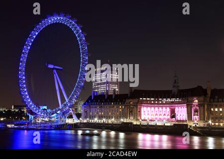 London, UK, September 13, 2011 : River Thames cityscape at night showing the London Eye and  County Hall which are popular tourism travel destination Stock Photo