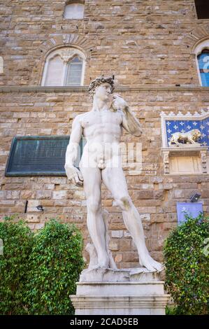 Replica of Michelangelo's David statue. This copy of the Michelangelo sculpture stands in front of Palazzo Vecchio / Palazzo della Signoria, Stock Photo