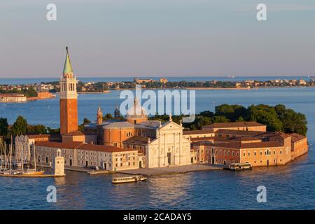 Basilica of San Giorgio Maggiore in Venice, Italy. Panoramic bird's-eye view. Lido Island in the background. Stock Photo