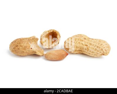 heap of peanuts in shell and broken, food isolated on white background, close up Stock Photo