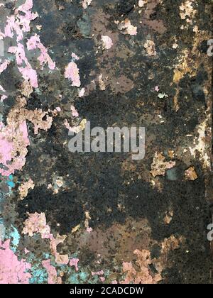 Rusty background A rusty old metal plate with cracked white gloss paint Stock Photo