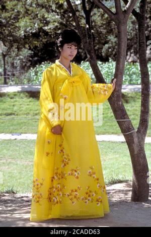 Yongin, Korea, 1988: Asian woman dressed in hanbok, traditional Korean dress, in Folk Village near Seoul, Korea. ©Bob Daemmrich Stock Photo