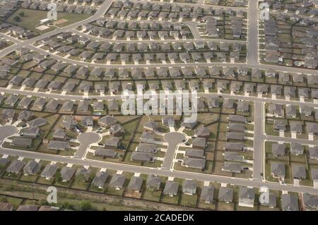 Austin, Texas USA, April, 2006: Aerial view of treeless suburban middle-class housing development in Round Rock, a northern suburb of Austin. Stock Photo