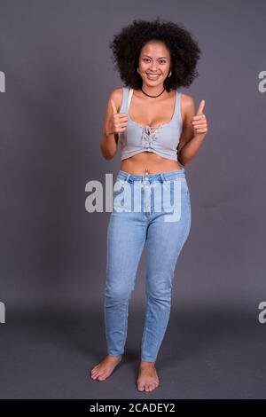 Happy young beautiful African woman with Afro hair Stock Photo