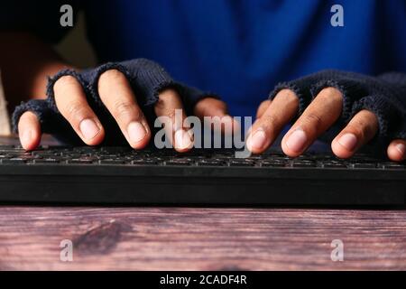 Close up of hacker hand stealing personal data  Stock Photo