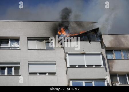 Bucharest, Romania - August 6, 2020: A fire spread across an apartment in a block of flats. Stock Photo