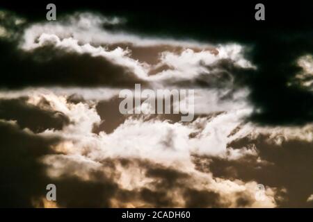 Full Sturgeon moon illuminates clouds over Rocky Mountains, Salida, Colorado, USA Stock Photo