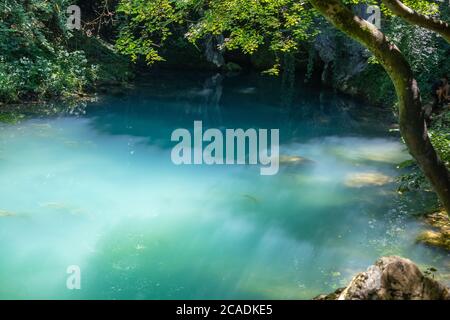 Krupajsko Vrelo (The Krupaj Springs) in Serbia, beautiful water spring with waterfalls and caves. Healing light blue water. Stock Photo