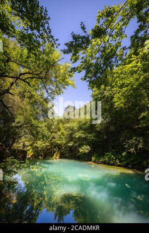 Krupajsko Vrelo (The Krupaj Springs) in Serbia, beautiful water spring with waterfalls and caves. Healing light blue water. Stock Photo