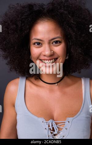 Happy young beautiful African woman with Afro hair Stock Photo