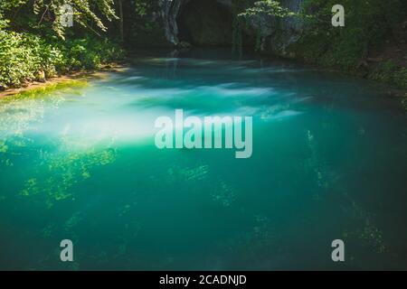 Krupajsko Vrelo (The Krupaj Springs) in Serbia, beautiful water spring with waterfalls and caves. Healing light blue water. Stock Photo