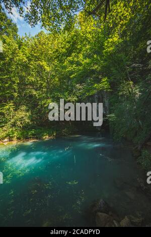 Krupajsko Vrelo (The Krupaj Springs) in Serbia, beautiful water spring with waterfalls and caves. Healing light blue water. Stock Photo