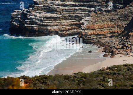 Disa Beach in the Cape Point National Park. The beach is accessed via a stairway from the parking area above. The rugged rocks are an iconic feature. Stock Photo