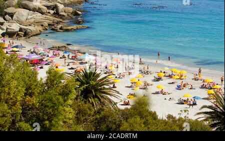 An overview of Clifton Fourth Beach at the end of summer showing the beautiful clear blue-turquoise water and the clean white sand. Stock Photo
