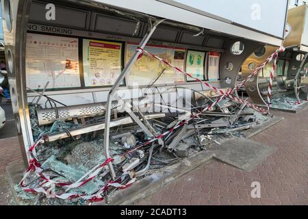 DUBAI, UAE - JANUARY 26, 2016: Broken glass window bus stop Frame in Dubai. Stock Photo