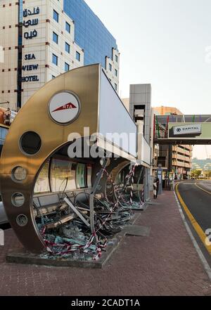 DUBAI, UAE - JANUARY 26, 2016: Crash glass window air conditioned bus stop Frame in Dubai. Roads and Transport Authority (RTA) of the bus stops here a Stock Photo