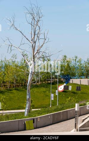 Large sculpture of wheel typewriter eraser with brush and a metal tree in Olympic Sculpture Park in Seattle, Washington.  Image taken in 2009. Stock Photo