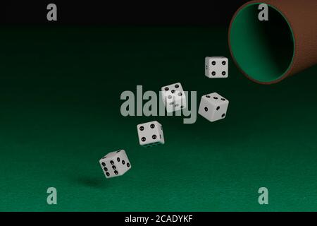 Dice rolling on a green cloth. 3d illustration. Stock Photo