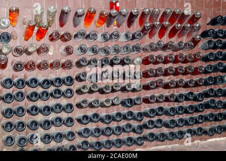 Many wine bottles in wine cellar of winery Stock Photo