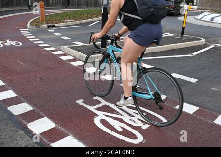 Cambridge, UK - 6 August 2020 UK's first Dutch-style roundabout in Cambridge near Addenbrooke's Hospital that gives priority to bicycles. Cambridgeshire County Council's £2.3million project gives cyclists an outer ring on the roundabout, with cycle crossings over each of the four approach roads in a contrasting red surface, and motorists must give way to pedestrians and cyclists when joining and leaving the roundabout.  Credit: Nils Jorgensen/Alamy Live News Stock Photo