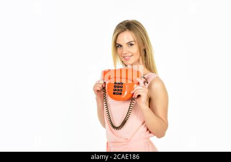 gossip girl. Pin up woman talking on the phone. good news. happy calling. old fashioned secretary. Happy pin up girl talking on retro telephone. modern businesswoman with vintage phone. Stock Photo