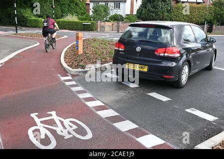 Cambridge, UK - 6 August 2020 UK's first Dutch-style roundabout in Cambridge near Addenbrooke's Hospital that gives priority to bicycles. Cambridgeshire County Council's £2.3million project gives cyclists an outer ring on the roundabout, with cycle crossings over each of the four approach roads in a contrasting red surface, and motorists must give way to pedestrians and cyclists when joining and leaving the roundabout.  Credit: Nils Jorgensen/Alamy Live News Stock Photo