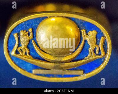 Egypt, Cairo, Tutankhamon jewellery, from his tomb in Luxor : Ring with a sun barque, adored by monkeys (hamadryas). Stock Photo