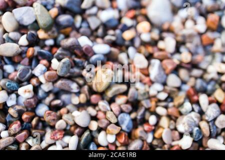Background of colored sea pebbles on the beach of Alanya, Turkey. Seamless texture Stock Photo