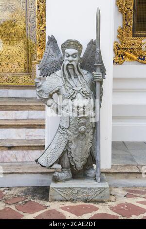 Chinese stone guardian statue in Wat Pho buddhist temple complex in Bangkok, Thailand Stock Photo