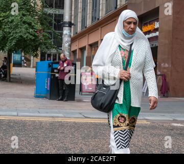 Glasgow, Scotland, UK. 6th August, 2020. UK Weather. A woman walking down Buchanan Street on a sunny day in the city. Credit: Skully/Alamy Live News Stock Photo