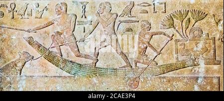 Egypt, Cairo, Egyptian Museum, from a tomb in Meidum : Sheperds on a payrus boat. One of them holds a calf, fallen in the water, by a rope. Stock Photo