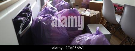 Kitchen is full garbage bags and cardboard boxes Stock Photo