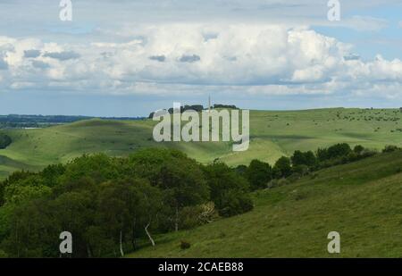 View from Morgans Hill towards the Lansdowne monument on Cherhill Down with sun dappled rolling hills in the foreground,Wiltshire.UK Stock Photo