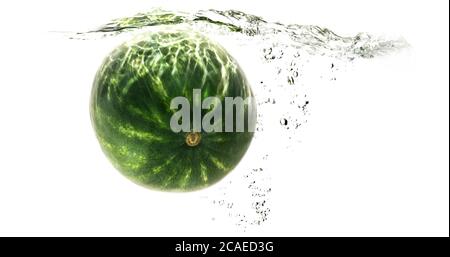 one green striped watermelon falling into water on a white background with splashes, drops and bubbles. summer fruit and berry. soft focus. Stock Photo