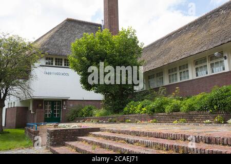 Fabritius school with straw roofing built in 1925 by architect Dudok, Hilversum Netherlands Stock Photo