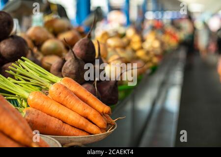 Raw carrots and beetroots on the counter. Stock Photo