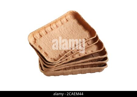 Biodegradable food trays made from pressed cardboard isolated on white background. Closeup Stock Photo