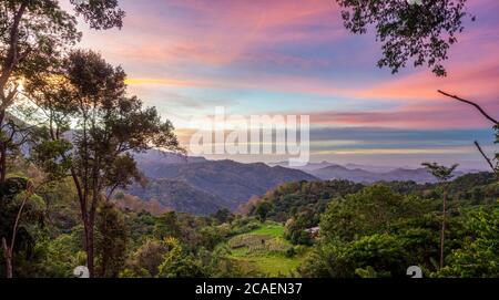 Sunrise over the mountains. Sri Lanka landscapes nature background. Ella, Sri Lanka. Mountain landscape in the morning with cloudy sky Stock Photo