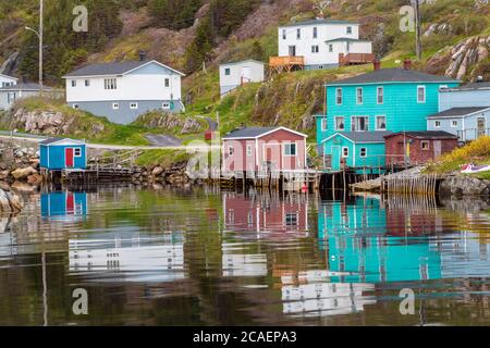 Colourful houses overlooking inner harbour of Rose Blanche, with moored fishing boats, Rose Blanche, Newfoundland and Labrador NL, Canada Stock Photo