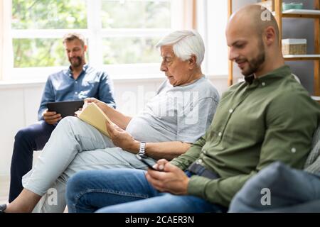 Three Generation Men Spending Time Together At Home Stock Photo