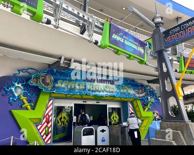 Orlando,FL/USA- 7/25/20: The entrance to the Buzz Lightyear Space Ranger Spin  ride wearing face masks and shields at Walt Disney World in Orlando, Fl Stock Photo