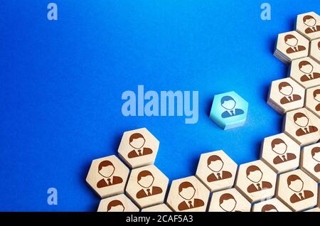 An employee leaves a large group of people. Exit from mainstream society. A talented employee, professional growth, search for a new promising job. Tr Stock Photo
