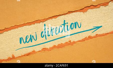 new direction, leadership, business or personal development concept - handwriting and sketch on handmade paper, web banner Stock Photo